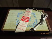 Tray top view with cord and paper sleeve