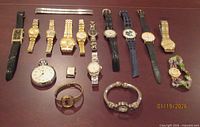 Group shot of all seventeen timepieces including separate bracelet