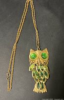 Full view of owl pendant necklace with chain