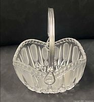 Front view showing frosted oval panels, scalloped rim, glass handle upright