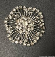 Front view showing full starburst design and rhinestone layout