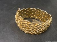 Top angle showing full braided design and clasp