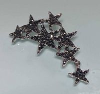 Front view of brooch showing star arrangement and black rhinestones