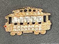 front view of trolley brooch showing rhinestone decoration