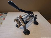 Full view of Chard manual French fry cutter showing lever handle and suction feet