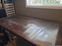 Full view of clear vinyl protector laid on table