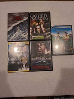 Front view of five DVD cases showing titles