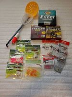 Full lot layout showing lines, baits, hooks, net, bobber