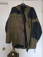 Front view of Gander Mountain jacket hanging, hood visible
