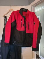 Full jacket front with pants partially visible