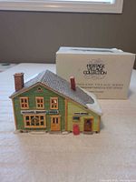 Front view of porcelain building and box