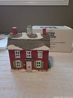 Front view of Brick Town Hall figurine with box in background