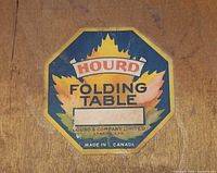 Close-up of manufacturer label on table underside