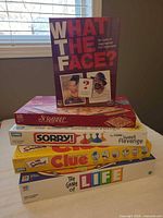 Stacked view of all five boxed board games
