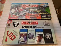 Top view of both Monopoly collector's edition game boxes