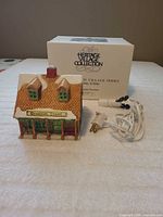 Front view of General Store building with power cord and box