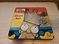 closed Homer crown embossed tin box lid
