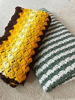Both folded blankets showing colors and patterns