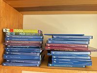 Two stacks of Great Courses DVD sets, PBS DVDs visible on top left