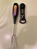 Front view of Perfect Chef thermometer fork and SnG folding thermometer