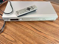 Player with remote on top, full view