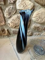Art glass swung vase next to Cambridge Glass Caprice pedestal plate
