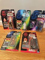 Group shot of all five sealed Star Wars action figures on card