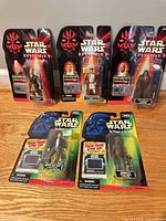 Group shot of five factory-sealed Star Wars figures