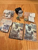 Group shot of all Tombola puzzles, capsule egg, and Yoda figures