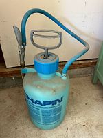 Full view of Chapin sprayer showing tank, pump handle and hose