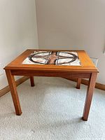 Overall view of Trioh tile-top teak table