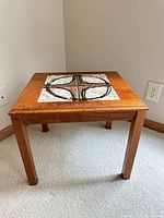 full view of square tile-top Trioh table