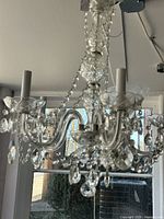 Full view of Verona 5-light crystal chandelier showing metal frame, glass arms, crystal drops, candle sleeves