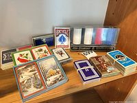 All playing card decks and poker chip set arranged on shelf