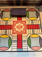 Full view of Parcheesi board with storage box centered
