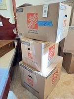 Stack of Home Depot medium, large and extra-large boxes