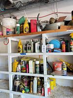 Full shelving view showing majority of fluids, aerosols, tools and funnels