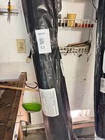 Partial view of individual wrapped sweep showing MaxSold lot sticker