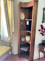 Full view of corner shelf showing five tiers and finish