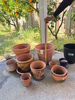 group of all planters with yardstick showing tallest pot ~20 in