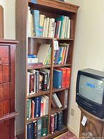 Full view of bookcase filled with books