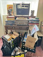 Front view of Sony TC-260 recorder on desk showing speakers, controls and carry handle