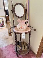 Full view of wooden washstand with mirror, basin and pitcher in place