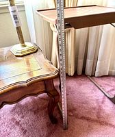 Side view showing TV tray height with yardstick alongside end table corner