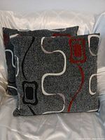 Both square pillows showing front pattern