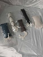 All five cat kicker toys in clear plastic sleeves on surface