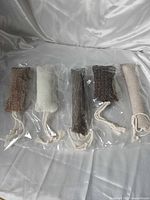 Five cat kicker toys in packaging laid out side by side