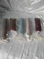 Front view of all five catnip toys in plastic sleeves
