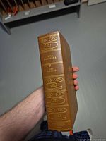 Spine showing title, author, publisher’s decorative gilt design