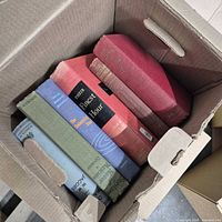 Top view showing assorted hardcover spines for identification